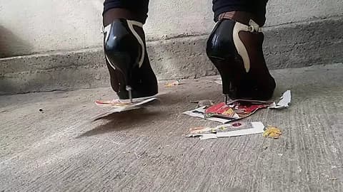 Girl trampling stomping on picture in metal high heels