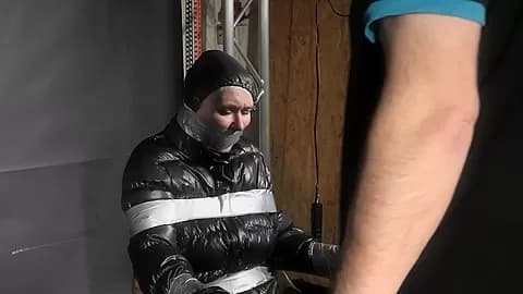 Alice Taped To A Chair And Tapegagged In Shiny Nylon Downjacket