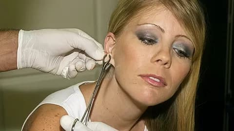 Tiny MILF Tabitha James Gets a Huge Piercing on her Ears - AltErotic